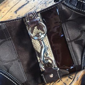 Coach handbag, monogram and snake skin details.